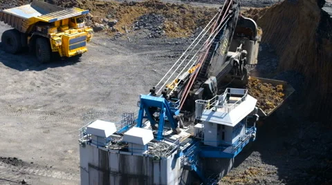 A large excavator loads Stock Footage 63361496