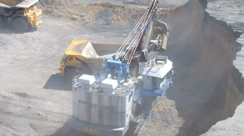 A large excavator loads Stock Footage 63361883