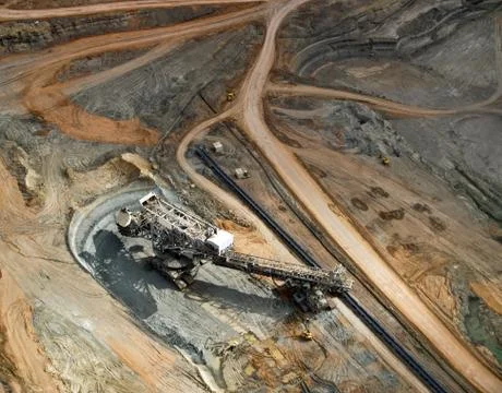 Large excavator in surface coal mine, aerial view Stock Photos