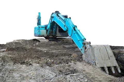 A large excavator is working in a workplace, isolated on a white background. Stock Photos