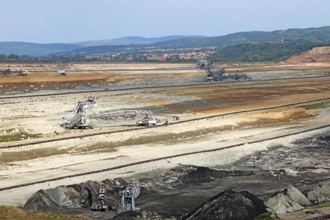 Large excavators digging coal open pit coal mine 스톡 사진
