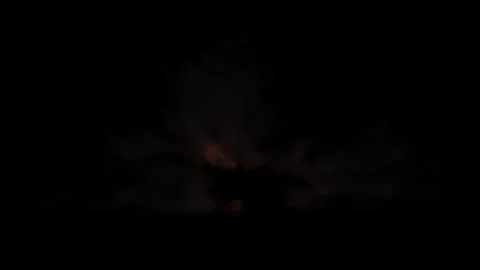 Large explosion with shafts of fire and smoke Stock Footage 303087539