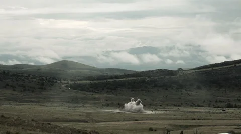 Large explosion with visible shockwave, and smoke drifting off. Video stock 52703127