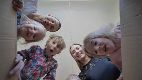 A large family opens the parcel. Video stock 126554834