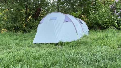Large family tent for camping in the forest, summer camping Stock Footage 336407953