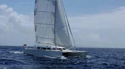 A large, fast sailing catamaran under full sail 2 Stock Footage 24684208