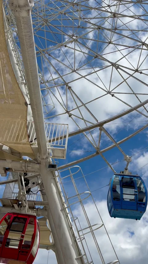 Large Ferris wheel with colorful gondolas Stock Footage 302956953