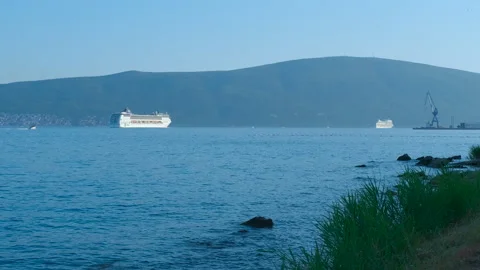 Large ferry navigating calm blue sea waters Видео 334734740