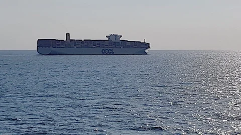 Large ferry sails on calm endless sea water reflecting sun Stock Footage 113187658