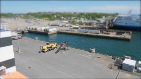 A large ferry sits in the harbor waiting to cross the ocean Stock Footage 77364646