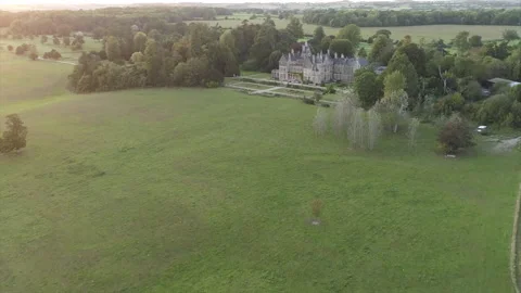 A large field with a house in the background Stock Footage 301627889