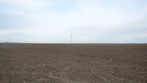 Large field ready for sowing in spring. Agricultural land ready for seeding Stock Footage 125897160