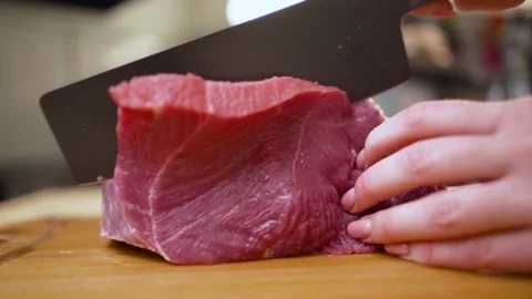 Large filet mignon beef steak is lying on cutting board in kitchen. cook cuts Stock Footage 166593531