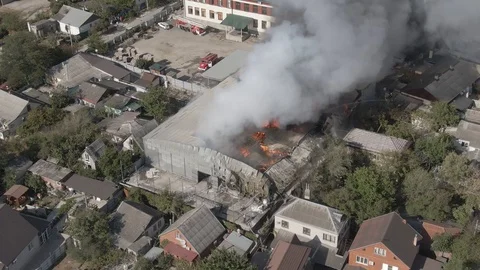 Large fire at a building materials warehouse in a residential industrial area Stock Footage 116172805