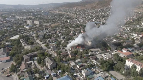 Large fire at a building materials warehouse in a residential industrial area Stock Footage 116172880
