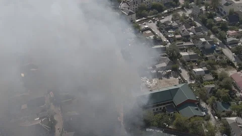 Large fire at a building materials warehouse in a residential industrial area Stock Footage 116172963