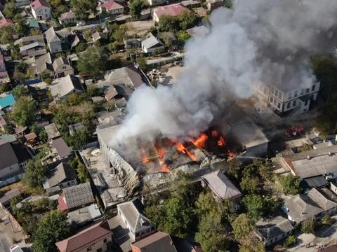Large fire at a building materials warehouse in a industrial area Stock Photos