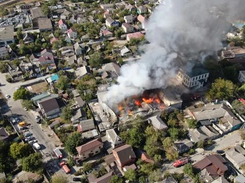 Large fire at a building materials warehouse in a industrial area Stock Photos