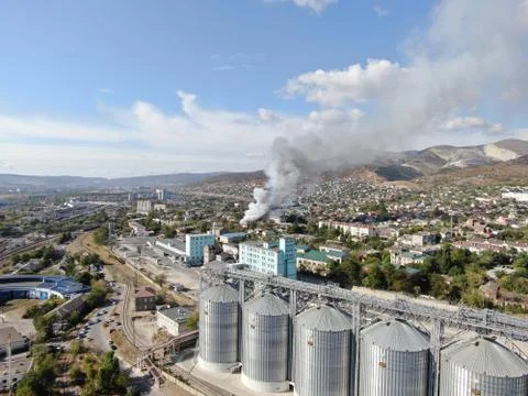 Large fire at a building materials warehouse in a industrial area Stock Photos