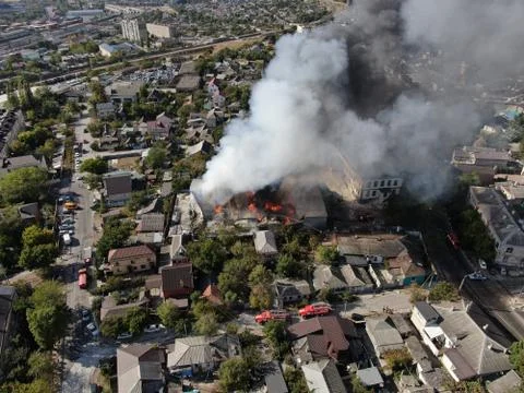 Large fire at a building materials warehouse in a industrial area Stock Photos