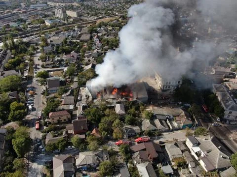 Large fire at a building materials warehouse in a industrial area Stock Photos