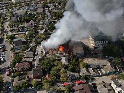 Large fire at a building materials warehouse in a industrial area Stock Photos