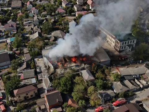 Large fire at a building materials warehouse in a industrial area Stock Photos