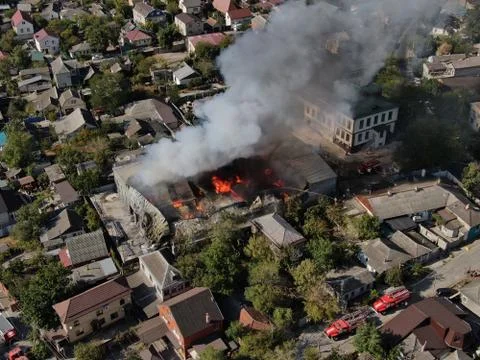 Large fire at a building materials warehouse in a industrial area Stock Photos