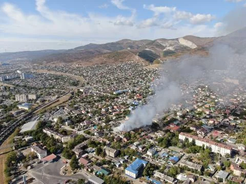 Large fire at a building materials warehouse in a industrial area Stock Photos