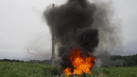 Large fire burning on green grass in the outdoor environment Stock Footage 97869008