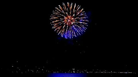 Large Firework Exploding Over A Lake Stock Photos