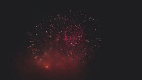 Large fireworks exploding and spreading golden sparks across dark night sky Stock-Footage 340632824