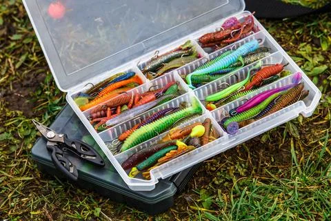 A large fisherman's tackle box fully stocked with lures and gear for fishing. Stock Photos