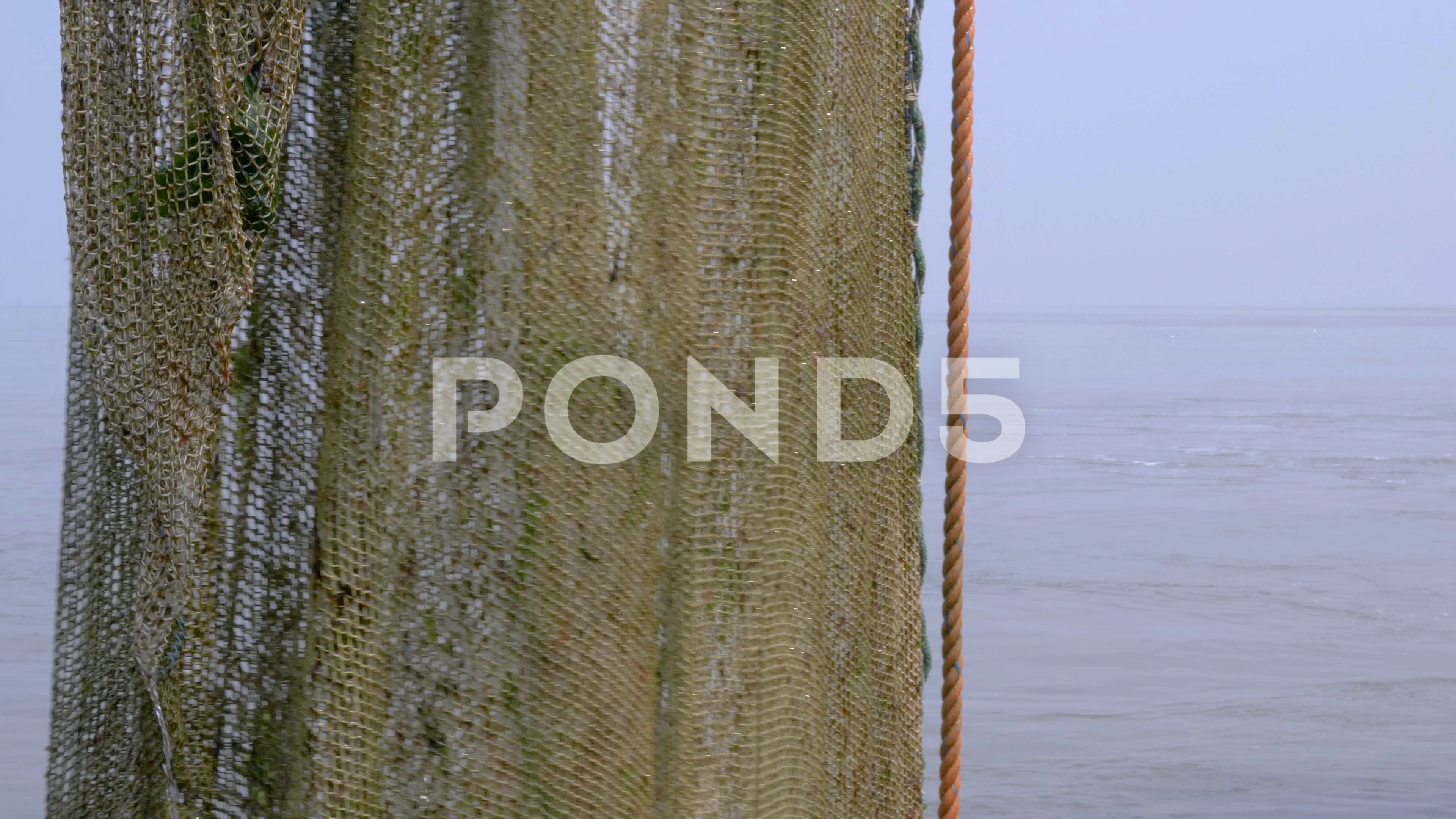 https://images.pond5.com/large-fishing-net-slowly-swinging-114008748_prevstill.jpeg