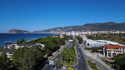 A large flag of Turkey flutters on a flagpole. Aerial 4k shooting from a drone Video stock 224636808