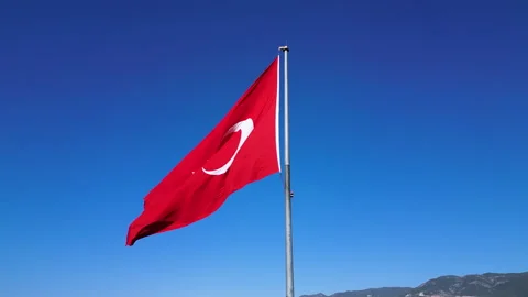 A large flag of Turkey flutters on a flagpole. Aerial 4k shooting from a drone Video stock 224637174