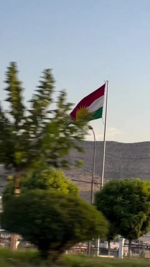 Large Flag Waving Against Mountain Background Stock Footage 342267926