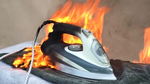 Large flame and Smoke coming from under the hot iron. Fire on the iron for Stock Footage 137218447