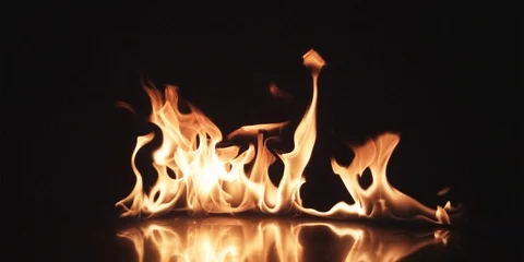 Large flame on black surface Stock Footage 102127395
