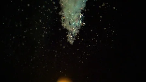 Large flame of fire through water bubbles Stockbeeldmateriaal 84041798