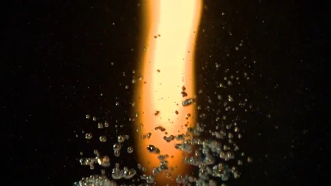 Large flame of fire through water bubbles Stock Footage 84041833