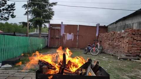 Large flame in the grill slow motion Stock Footage 108373015