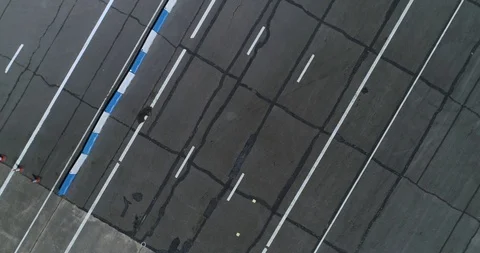 Large flat asphalt area, disused English runway aerial 4k Stock Footage 124647238