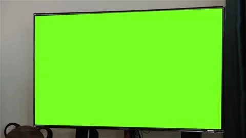 Large Flat Screen Television Showing Green Screen for Keying Stock Footage 101766268
