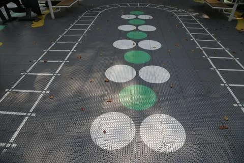 A large, flat surface with green and white dots on it in the shape of circles Foto stock