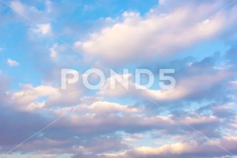 Large floating clouds in the sky at sunset day. Nice bright background ...
