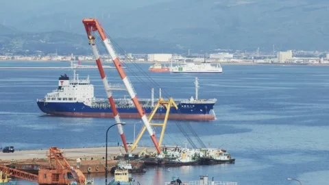 Large floating crane and cargo ship in a harbor, Hakodate, Japan, 2026.09.10. 動画素材 345434844