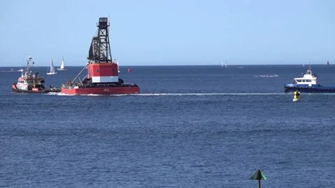 Large floating crane being towed across Plymouth Sound England. Stock Footage 136949159