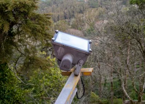 A large floodlight is fixed at a height Stock Photos