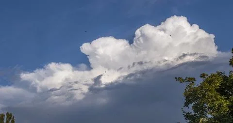 A large fluffy cloud illuminated by the sun Stock Photos